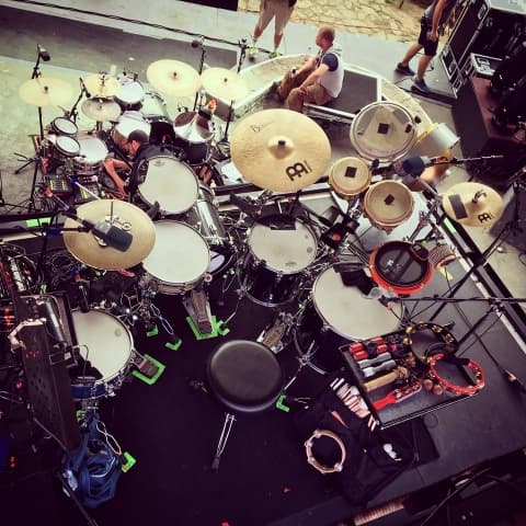 Overhead view of professional touring drum kit with Meinl cymbals on outdoor festival stage in Germany