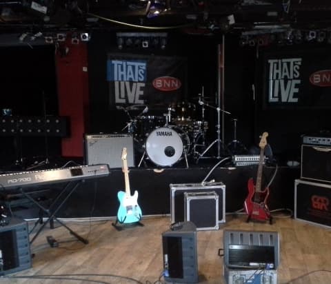 Full backline stage setup with Yamaha drums Roland keyboard and Fender guitar at That's Live BNN Netherlands production