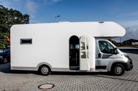 Rocking Owl Tour Service mini nightliner on Fiat Ducato base with custom body and open door in Poland