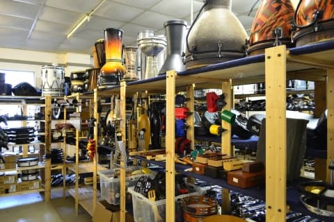 EVS Backline Cologne percussion and drum accessory inventory including congas bongos and hand percussion