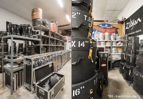 TBS Backline Berlin warehouse showing touring drum and cymbal flight cases with Zildjian inventory in storage