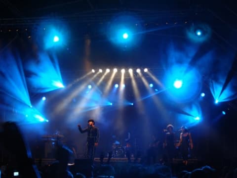 Event Sound and Light Ltd outdoor festival stage with blue wash and beam lighting on live concert production